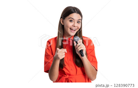 teen girl singer holding microphone point finger in studio. teen girl singer with singing microphone. teen girl singer holding microphone point finger in studio. teen girl singer with singing microphone. 128390773