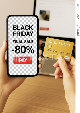 Woman hand using tablet with black Friday sale on screen device background for mock up, template, technology and lifestyle concept 128390986