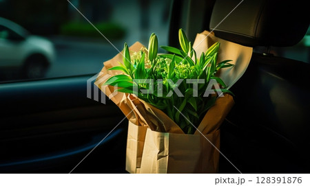 Fresh Green Plants in Paper Bags Ready for Home Delivery in Nighttime City Atmosphere. 128391876