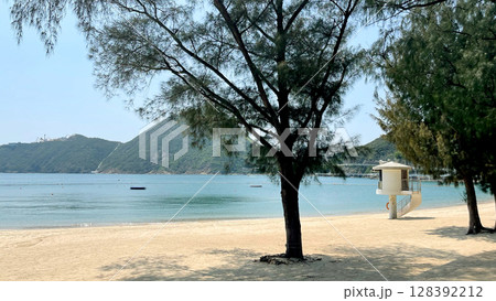 Outdoor beach, sands, trees, water, lifeguarde safety station in Hong Kong Repulse Bay 128392212