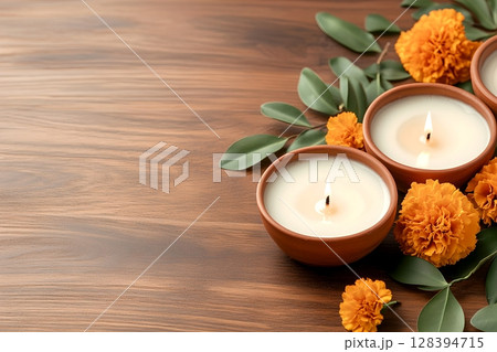 Cozy arrangement of traditional clay diyas oil lamps decorated with vibrant marigold flowers creating a warm and serene ambiance for a festive celeb n Cozy arrangement of traditional clay diyas oil lamps decorated with vibrant marigold flowers creating a warm and serene ambiance for a festive celeb n 128394715