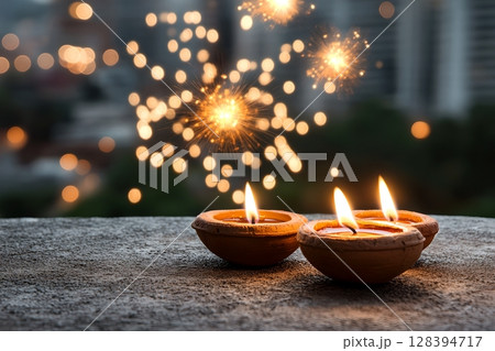 Festive Diwali celeb n with traditional clay lamps diyas glowing on a terrace set against a backdrop of a twinkling city skyline at night Festive Diwali celeb n with traditional clay lamps diyas glowing on a terrace set against a backdrop of a twinkling city skyline at night 128394717