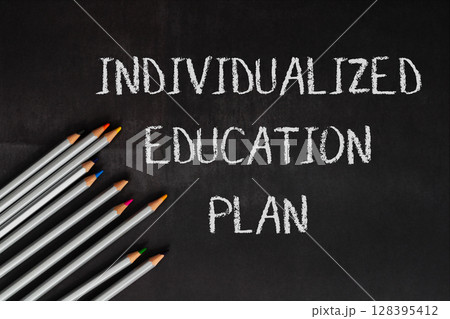 A chalkboard with a pencils 128395412