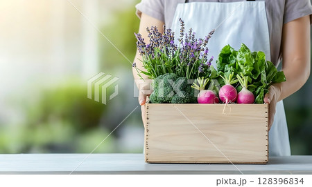 Fresh Organic Vegetables and Herbs in Wooden Box Held by Person in Bright Kitchen Fresh Organic Vegetables and Herbs in Wooden Box Held by Person in Bright Kitchen 128396834