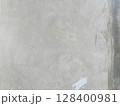 concrete wall with a plaster on a wall 128400981