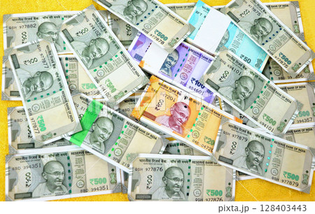 piles of new indian currency notes rupees 50,100,200 and 500 piles of new indian currency notes rupees 50,100,200 and 500 128403443