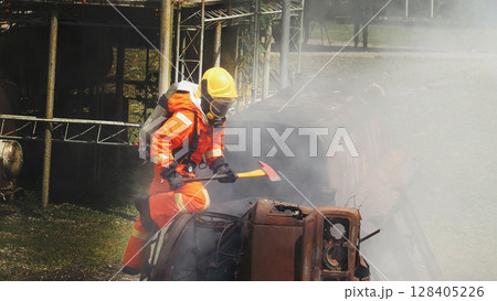 Firefighter fighting smoke flame use fire hose chemical water foam spray engine. Firefighter Rescue training in fire fighting extinguisher. Fireman wear hard hat safety suit uniform for protection Firefighter fighting smoke flame use fire hose chemical water foam spray engine. Firefighter Rescue training in fire fighting extinguisher. Fireman wear hard hat safety suit uniform for protection 128405226