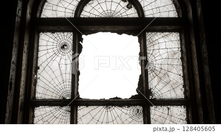 Transparent center hole in old arched cracked window 128405605