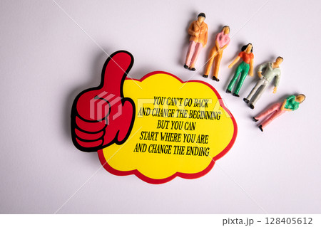 Motivational Message with Thumbs Up Icon and Miniature People on White Background Motivational Message with Thumbs Up Icon and Miniature People on White Background 128405612