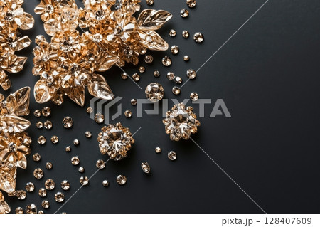 Diamonds and golden leafes on the edges of the picture. Top view Diamonds and golden leafes on the edges of the picture. Top view 128407609