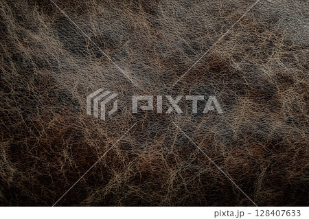 Rich leather texture with worn patches and creases 128407633