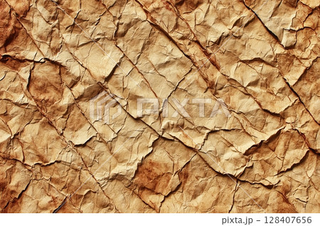Intricate aged parchment texture with creases and stains 128407656