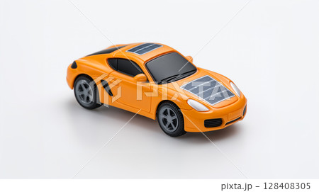 Orange sports car toy model with solar panels demonstrating sustainable transportation technology 128408305