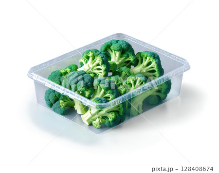 Broccoli (Brassica oleracea) Fresh broccoli florets neatly packed in clear plastic. The vibrant green florets are clearly visible through the 128408674