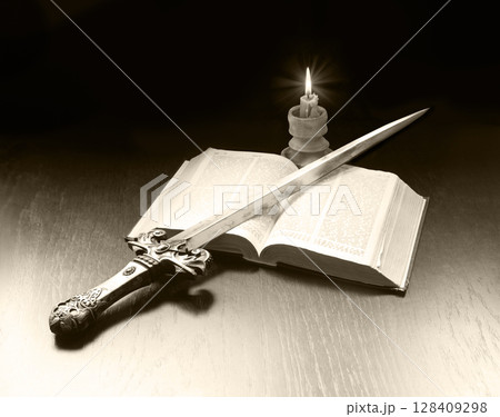 Old book and sword on the table Old book and sword on the table 128409298