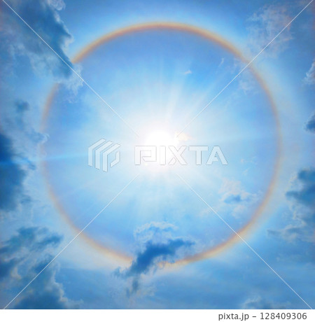 Halo. Rainbow circle around the sun 128409306
