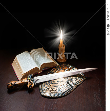 Book with sword and shield 128409307