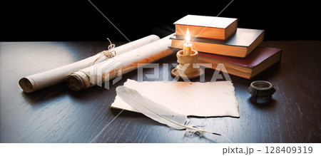 Books and candle on the table Books and candle on the table 128409319