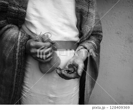 Ancient man with silver coins 128409369