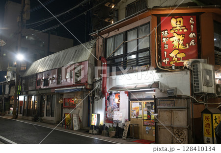 traditional ramen store open at night in sun road arcade. 128410134