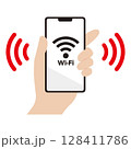 Wi-Fiに接続されたスマートフォンを持つ手のイラスト素材 128411786