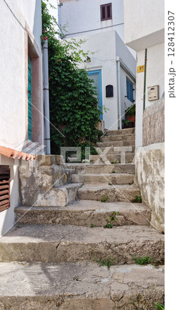 Narrow street in the old town of Baska 128412307