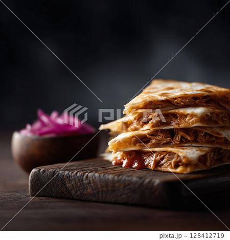 Stacked quesadillas on wood with pickled onions. Food photography showcasing culinary deliciousness. Perfect for restaurant menus, blogs,  foodrelated advertisements. 128412719