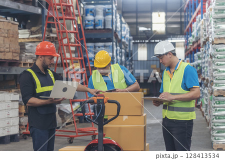 Warehouse worker teamwork diversity men using laptop computer logistics checking products in store inventory. Warehouse management team partner engineer man work together checklist stock control Warehouse worker teamwork diversity men using laptop computer logistics checking products in store inventory. Warehouse management team partner engineer man work together checklist stock control 128413534