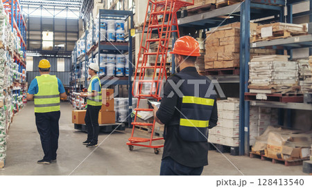 Warehouse management logistics team counting checking products on inventory shelf. Hispanic men worker check stock control in distribution storage. Teamwork shipment worker checklist quality control Warehouse management logistics team counting checking products on inventory shelf. Hispanic men worker check stock control in distribution storage. Teamwork shipment worker checklist quality control 128413540