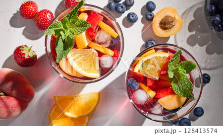 glass of drink with fruits 128413574