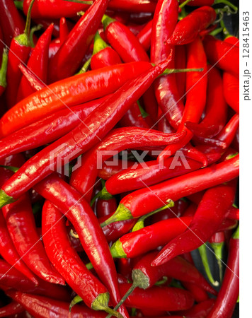 lots of red chili peppers for food as background lots of red chili peppers for food as background 128415463