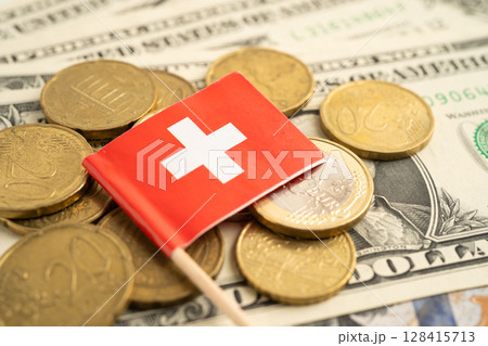 Stack of coins with Switzerland flag and US dollar banknotes. Stack of coins with Switzerland flag and US dollar banknotes. 128415713