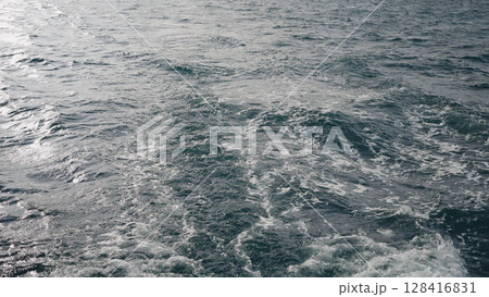 wake trail behind boat in Indian ocean wake trail behind boat in Indian ocean 128416831
