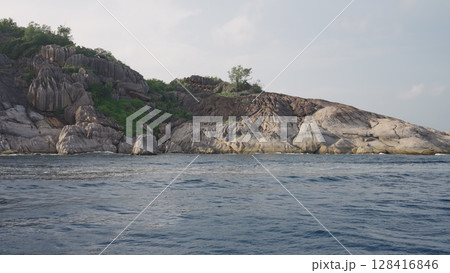 close view from a boat of Seychelles island in January 128416846