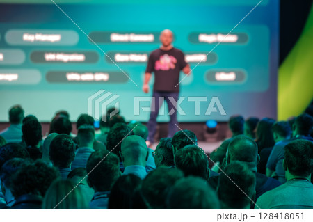 Speaker addressing audience during professional conference focused on business and technology topics Speaker addressing audience during professional conference focused on business and technology topics 128418051