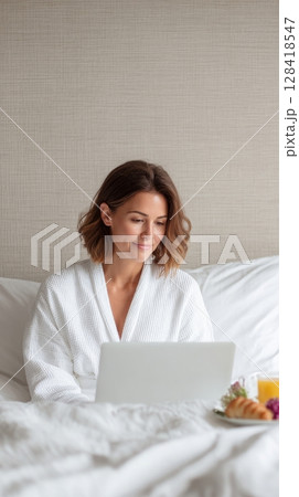 Young woman in cozy robe working on laptop in...のイラスト素材 [128418547] - PIXTA