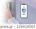 composite image of hand using smartphone shield security application 128418565