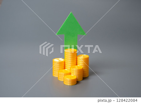 Stack of coins and green arrow pointing up. Financial growth, income increase, or investment success. Relevant for inflation trends, capital accumulation, or market optimism. Stack of coins and green arrow pointing up. Financial growth, income increase, or investment success. Relevant for inflation trends, capital accumulation, or market optimism. 128422084