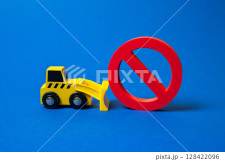 Bulldozer pushes prohibitory sign no. Cancellation of restrictions and rules. Political change, market liberalization, or loosening of control measures in business, infrastructure, or civil liberties. 128422096