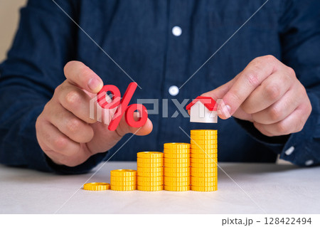 Rising housing costs. Mortgage interest rates. Housing affordability issues. Increased loan rates, higher property valuations, and cost-of-living growth in urban centers. 128422494