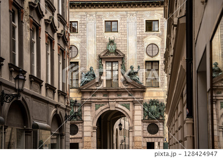 Munich Residenz Facing Residenzstrasse: Historic Royal Palace Entrance With Sculptures And Ornate Facade Between Narrow Streets In The City Center Munich Residenz Facing Residenzstrasse: Historic Royal Palace Entrance With Sculptures And Ornate Facade Between Narrow Streets In The City Center 128424947