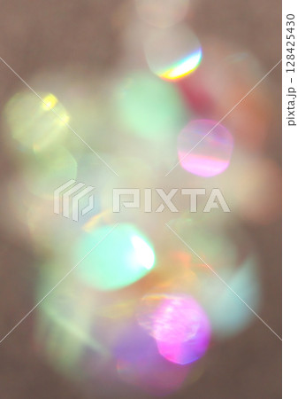 Soft focus colorful bokeh lights creating a dreamy abstract background 128425430