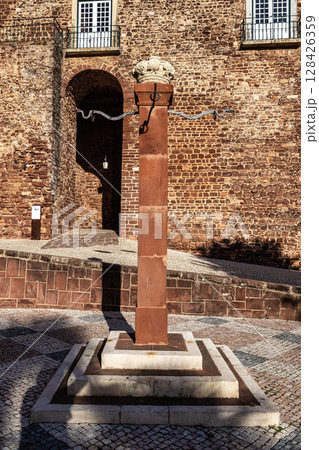 The Pillory, Pelourinho of Silves at the city gate building, Portas da Cidade in the centre of Silves, Portugal 128426359