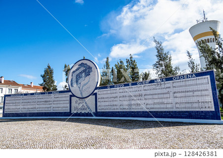 Tile mural with carnation and lyrics from the commemorative song of the 25th of April Grandola Vila Morena in Grandola, Portugal Tile mural with carnation and lyrics from the commemorative song of the 25th of April Grandola Vila Morena in Grandola, Portugal 128426381