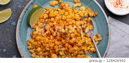 Esquites mexican street corn salad with chili, cilantro and lime juice Esquites mexican street corn salad with chili, cilantro and lime juice 128426562