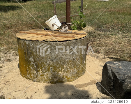 A mine well with concrete rings. Topped with white sand for protection and filtration. A mine well with concrete rings. Topped with white sand for protection and filtration. 128426610