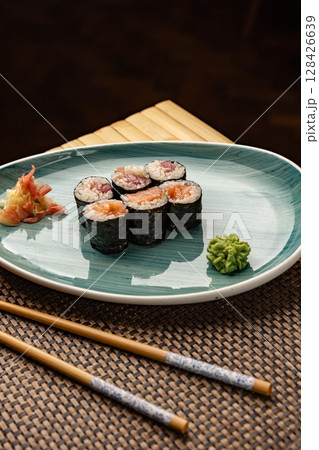 Fresh hosomaki rolls, filled with salmon and tuna, Fresh hosomaki rolls, filled with salmon and tuna, 128426639