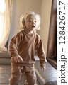 little boy playing, jumping on the sofa 128426717