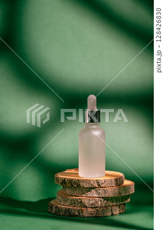 A frosted dropper bottle of facial serum A frosted dropper bottle of facial serum 128426830