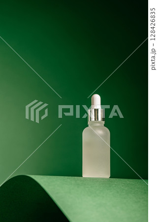 A frosted dropper bottle of facial serum A frosted dropper bottle of facial serum 128426835
